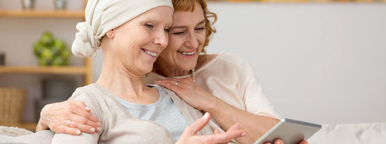 leukemia-two-women-smiling-tablet